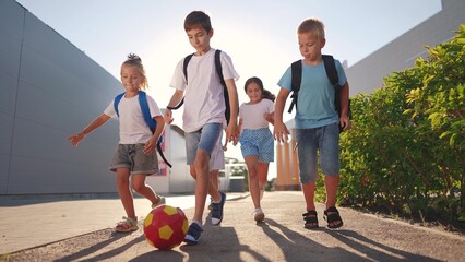 children near the school playing soccer. kids a school education kid dream concept. a group of children near the lifestyle school playing ball. group of school children playing