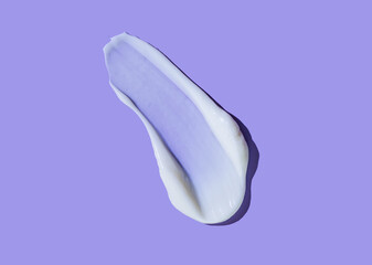 Face or body white cream hair balm cosmetic mask blue purple blueberry background texture