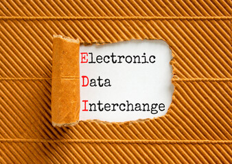EDI electronic data interchange symbol. Concept words EDI electronic data interchange on white paper on a beautiful brown background. Business and EDI electronic data interchange concept. Copy space.