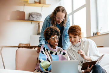 Colleagues collaborating in a modern freelance office space