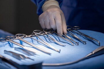 Hand of Team surgery doctor in Operating Room hold operating scissor give to Surgeons During...