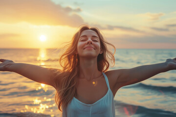 Fototapeta na wymiar Backlit portrait of a calm, happy woman enjoying freedom at sunset by the sea