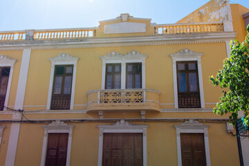 Old yellow house in a Spanish town - 786218018