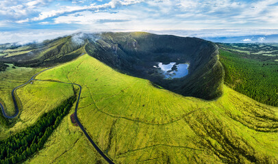 Azores, Faial island - Aerial view from drone to green volcano Caldeira at sunrise, Portugal