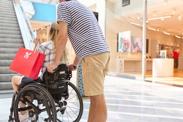 Shopping day at the mall with a person using a wheelchair enjoying inclusivity