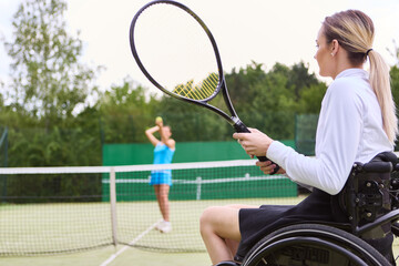Person using wheelchair playing tennis, showcasing inclusion and athletic ability