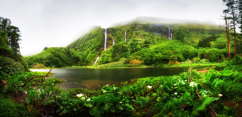 Fototapeta premium Panorama of Ribeira do Ferreiro waterfalls, green paradise hidden in Flores Island, Azores, Portugal