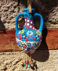 Oriental Turkish hanging home decor in the shape of a blue jug with floral ornament