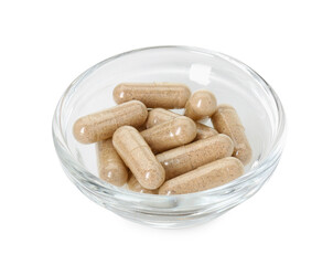 Vitamin capsules in bowl isolated on white. Health supplement