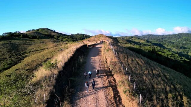 Drone footage of a small group of people walking on a hiking trail in northern Costa Rica