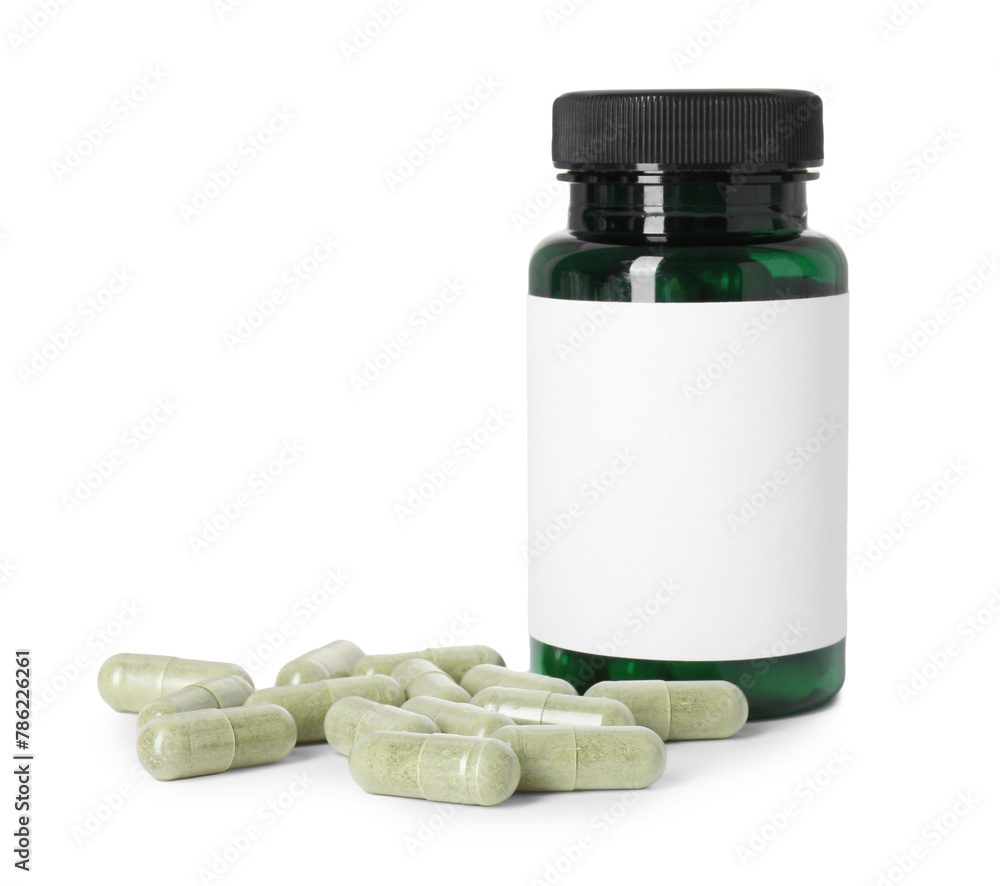 Wall mural Bottle and pile of vitamin pills isolated on white