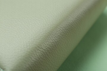 Beautiful green leather on table, closeup view
