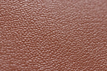 Brown natural leather as background, closeup view