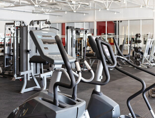 gym interior, modern machines treadmills and dumbbells