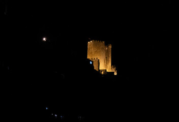 Alcalá del Júcar castle at night, located on a rock formed by the gorge of the Júcar River, from...