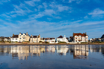 Low tide reflections at Rhosneigr beach, Anglesey - obrazy, fototapety, plakaty