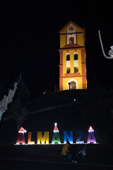 Almanza town at Christmas in which you can see the church with its Almanza sign with Christmas hats