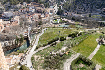 Panoramic view of the town of Alcalá del Júcar. Its popular Roman bridge, cave houses, river...