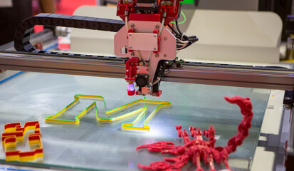 Three dimensional 3d printer printing letter M.