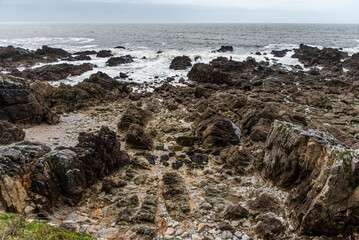Rocky ocean coast in Brittany, France at low tide. - 786243663