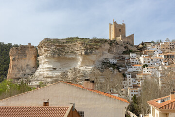 Panoramic view of the town of Alcalá del Júcar. Its popular cave houses, carved into the...