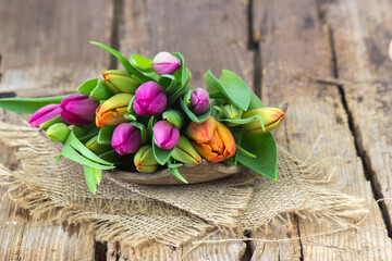 colorful tulips on wooden background - close up - 786244877