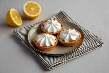 Homemade Lemon Tartlets on a Plate, side view. - 786246873