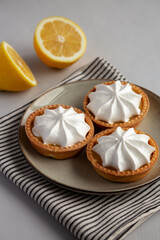 Homemade Lemon Tartlets on a Plate, side view. - 786247053
