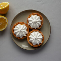 Homemade Lemon Tartlets on a Plate, top view. Flat lay, overhead, from above.
