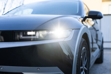 Switched on led matrix lights of luxury car. Car front full led matrix IQ Light. Modern car headlamp flashing light with blinking on continuously indicator. Car Blinker Light.