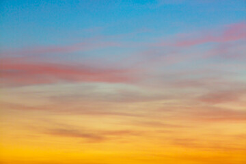 Clouds and orange sky,Real majestic sunrise sunset sky background with gentle colorful clouds...