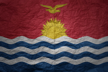 big national flag of Kiribati on a grunge old paper texture background
