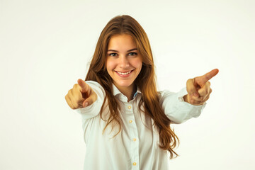 Young smiling woman pointing fingers at viewer on white background. Winner, job candidate and selection concept