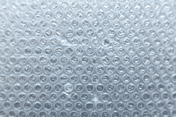 Close-up of a sheet of plastic wrap with bubbles. Abstract background.