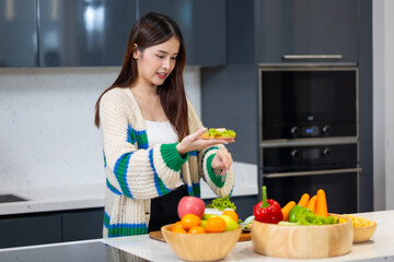 Diet lose weight and foods concept - Asian young attractive woman making sandwich clean vegetables healthy food for breakfast in morning at home.  healthy food for health