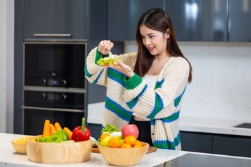 Diet lose weight and foods concept - Asian young attractive woman making sandwich clean vegetables healthy food for breakfast in morning at home.  healthy food for health