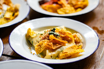 Close up plate of Pa Tor Veggie-Wrapped Rice on wooden table. Popular food of Uttaradit Province, Thailand