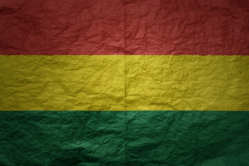 big national flag of bolivia on a grunge old paper texture background