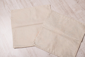 two beige pillowcases