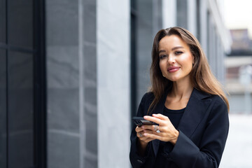 Mobile phone technology lifestyle - Hispanic business woman uses mobile phone device communicating...