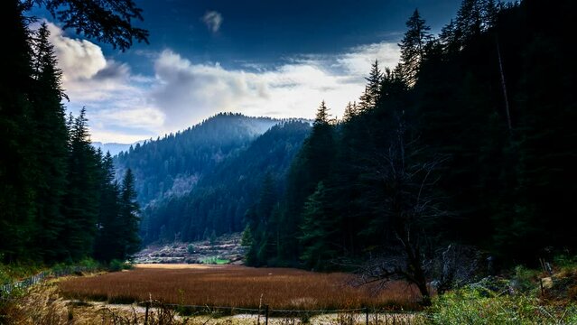 Timelapse of clouds flying over sacred Punrik rishi lake in himalayas, Sainj Valley, Himachal Pradesh