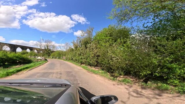 4k wide angle max super view point of view driving down country roads in England in Spring. 