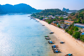 Aerial view big low tide in sea, traditional thai longtail boats stranded of Phi Phi island, Thailand