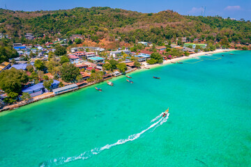 Amazing travel landscape photo in Thailand tourism. Aerial top view longtail boat on Phi Phi,...