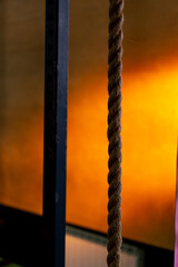 close-up of ropes for exercise in sports club on a bright orange background
