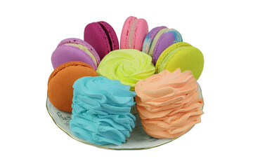Desserts. Traditional colored sweet desserts on a plate for the holiday.  Macaroons, marshmallows and zephyrs isolated on white background.