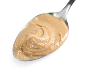 Delicious nut butter in spoon isolated on white
