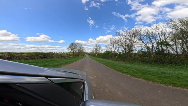 4k wide angle max super view point of view driving down country roads in England in Spring. 