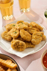 Plate of chicken nuggets on table, fast food dish