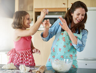 Mother, child and playful baking with dough for homemade cookies at home, bonding or dessert....